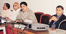 Mr Vijay Dhasmana (second from right) addresses a seminar on Spirituality, Stress and Health at the CRRID in Sector 19, Chandigarh, on Tuesday.