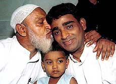 Suspected Al-Qaida terrorist Mohamed Afroz gets a kiss