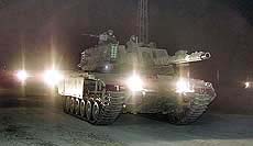 An Israeli tank pulls out from the West Bank city 