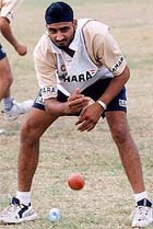 Indias spin bowler Harbhajan Singh works out during a team practice