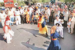 Devotees perform gatka at a nagar kirtan organised for Baisakhi in Chandigarh on Thursday.