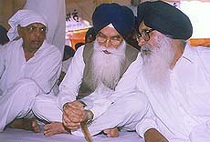 Mr Parkash Singh Badal, former Chief Minister and SAD chief, discusses a point with Mr Kirpal Singh Badungar