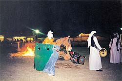 Folk dancers in a desert party