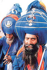 Two nihangs sporting turbans weighing 30 kg and 40 kg, respectively, at Baisakhi celebrations 