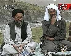 Osama bin Laden, right, listens as his top deputy Ayman al-Zawahri speaks