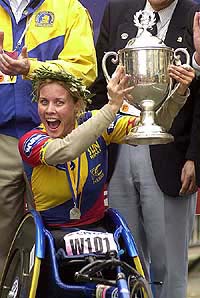 Edith Hunkeler of Switzerland celebrates with the trophy