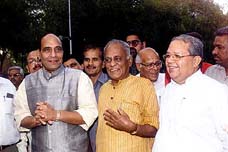 BJP president Jana Krishnamurthy flanked by former UP Chief Minister Raj Nath Singh