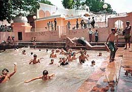 Devotees take a holy dip at ‘Mundan Ghat’ on the concluding day of Navratra Mela at Mansa Devi Temple, Panchkula