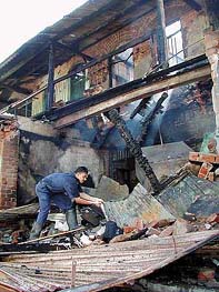 A fireman busy clearing the debris 
