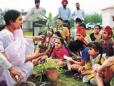 Children get tips on landscaping at a nursery