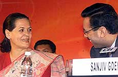 Congress President Sonia Gandhi and CII president Sanjiv Goenka share a lighter moment