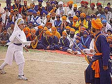 A Sikh girl plays "gatka" (traditional Sikh martial art) organised by the Sikh Virsa Sambhal Sanstha at Khalsa College, Amritsar, on Sunday.