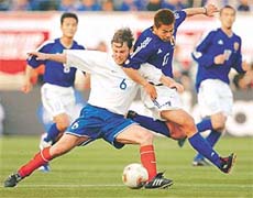 Slovakias Karol Kisel (L) fights for the ball