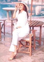 Miss India Neha Dhupia wearing a smile and a Giovani ensemble.