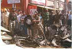 Army personnel catch hold of mangled remains