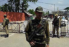 A policemen stands guard outside the Civil Secretariat in Srinagar