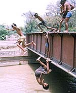 Children take a dip in a canal