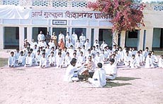 The inmates of the gurukul performing a yagna.