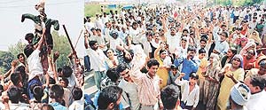 Janata Kumhar Colony residents block the cremation ground road in Sector 25 in Chandigarh on Friday to protest against a notice of vacating government land.