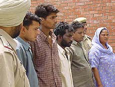 Arrested persons escorted by the police 