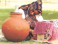 A roadside vendor snatching forty winks at the India Gate