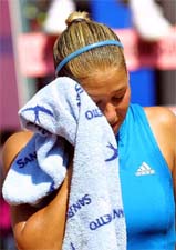 Russias Anna Kournikova reacts after losing her match