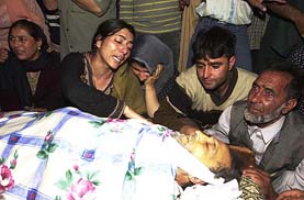 Relatives wail over the death of Abdul Ghani Lone