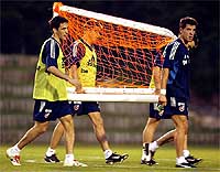 Spain's Raul , midfielder Joaquin and goalkeeper Pedro Contreras carry a goal