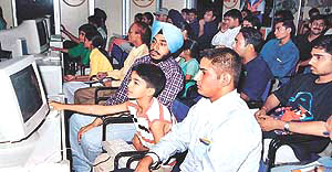 A child learns about the uses of a computer at a PC party organised by Intel in Chandigarh on Saturday.