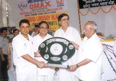 Indian Airlines captain Vijay Dahiya receiving the Goswami Ganesh Dutt Memorial Cricket Shield