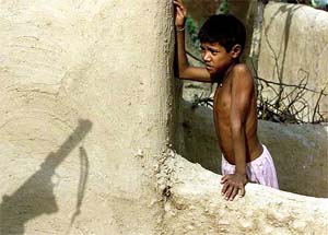 A boy looks at an Indian soldier