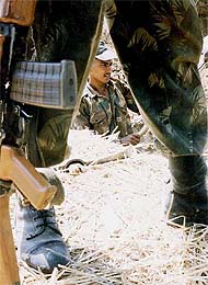A soldier digs trench near the Indo-Pak border