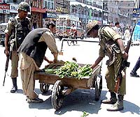 BSF personnel search a handcart