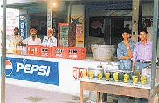 A contractor and his employees wait for buses