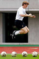 Belgium's goalkeeper Geert De Vlieger jumps over balls during a practise session at the KK Wing stadium in Kumamoto, Japan, on Wednesday.
