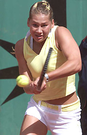 Anna Kournikova of Russia returns a backhand