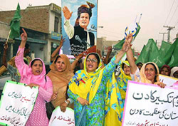 Workers of Nawaz Sharifs Muslim League Party celebrate missile tests in Multan on Tuesday.