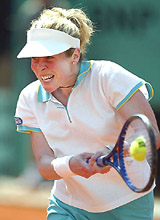 Amy Frazier of the USA returns a backhand