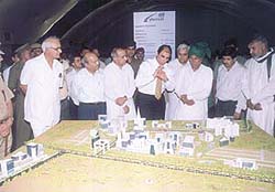 Chief Minister O.P. Chautala examines a model of the proposed cybercity.