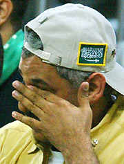 A fan of Saudi Arabia reacts