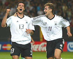 Germanys goalscorer Miroslav Klose and Michael Ballack (L) celebrate after scoring against Saudi Arabia during their group E match at the World Cup in Sapporo on Saturday.