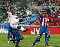 Sibusiso Zuma of South Africa leaps high as he makes a shot on goal 