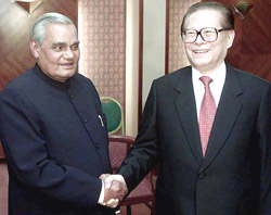 India's Prime Minister Atal Behari Vajpayee shakes the hand of China's  President