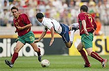 USAs Landon Donovan flies through the air