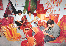 Students of the NIFD at work during an exhibition of their creations in Chandigarh on Friday. 
