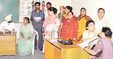 Patients being examined at an eye camp organised by the Tribune Youth Club at Tribune Model School, Sector 29, on Sunday.