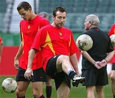 Belgium's defender Daniel Van Buyten and midfielder Marc Wilmots play with balls