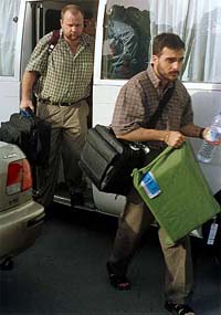 Unidentified UN staff members arrive at the Islamabad airport 