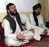 Hamidullah Tokhi, Governor of Zabul province where many Taliban sympathisers live, and Abdul Bari, head of the Governors security, discuss the upcoming Loya Jirga