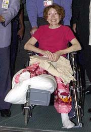 Recently freed American hostage Gracia Burnham is wheeled out of an elevator on Monday 